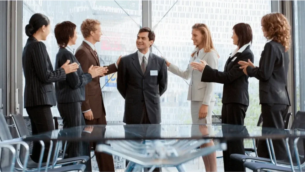 Business team celebrating a successful sales funnel strategy with a consultant